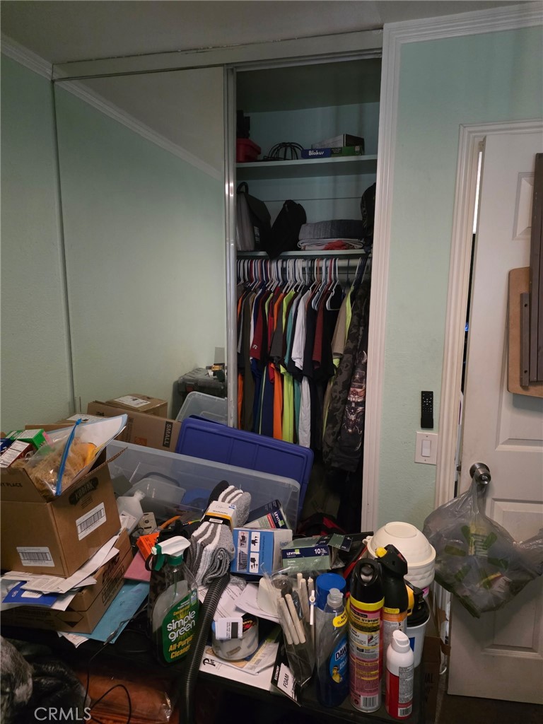 8710 Wahl Street Santee, CA 92071 - Photo 14 of 19 a view of walk in closet with clothes and shoes