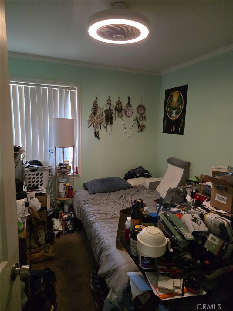 8710 Wahl Street Santee, CA 92071 - Photo 16 of 19 a bed room with a bed and a chair