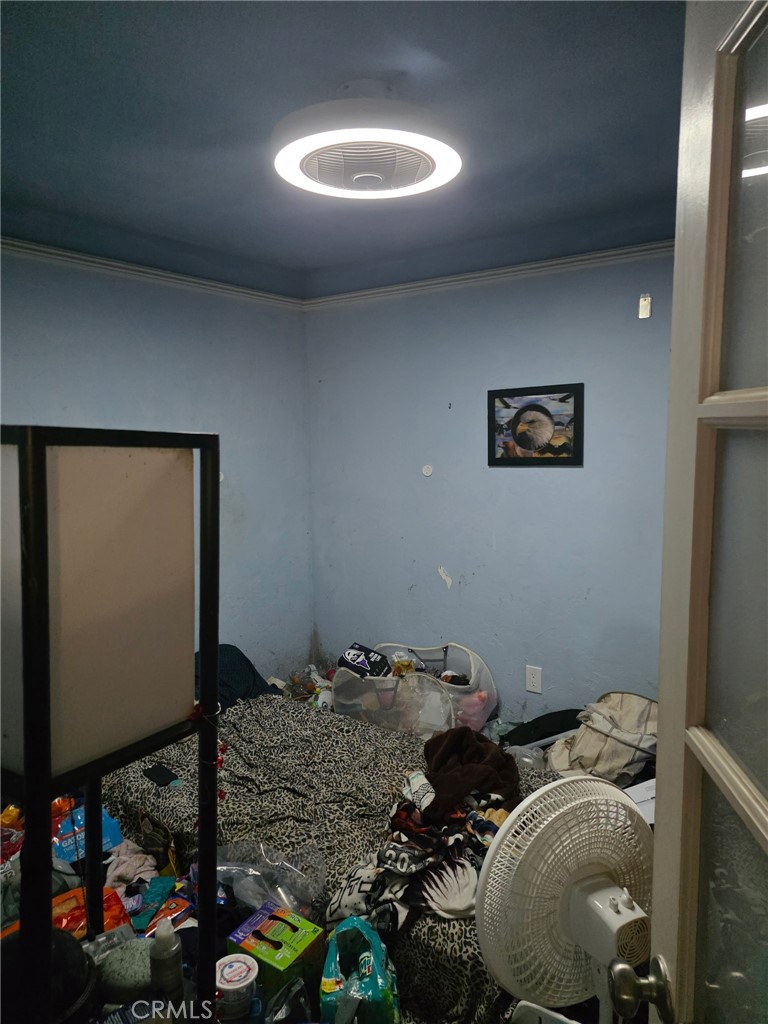 8710 Wahl Street Santee, CA 92071 - Photo 19 of 19 a bedroom with bed and a mirror