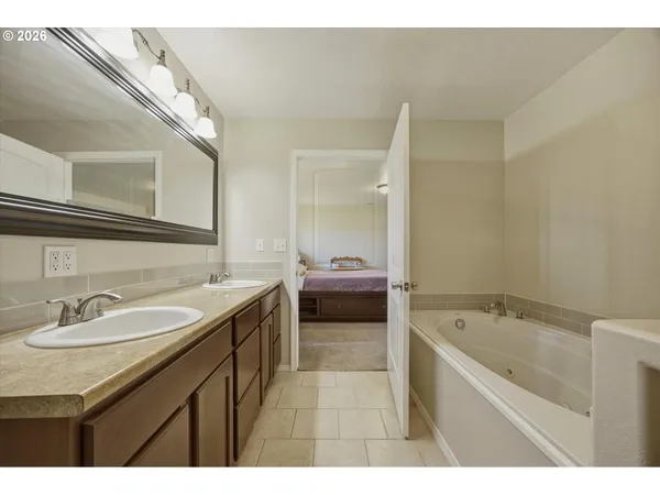 a view of a hallway with bathroom