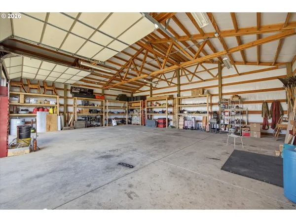 a view of a house with a swimming pool and a yard