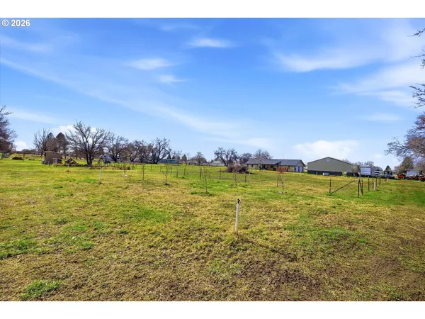a view of a backyard with sitting area