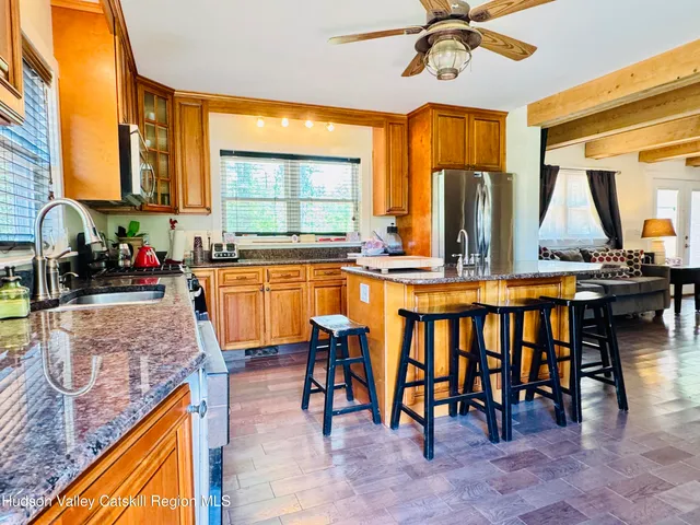 a kitchen with large windows
