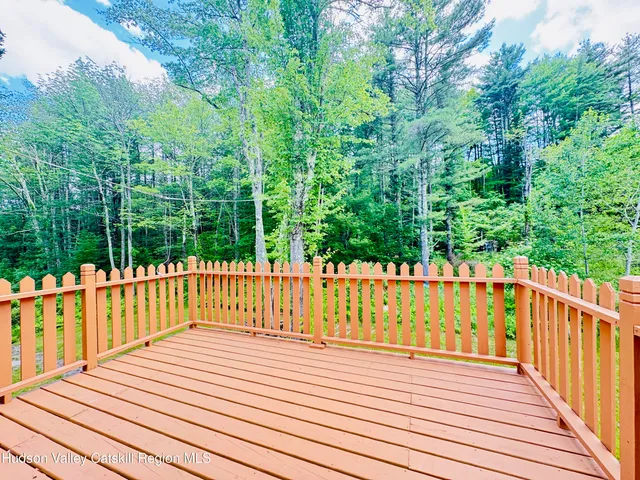 a bathroom with a toilet and a mirror