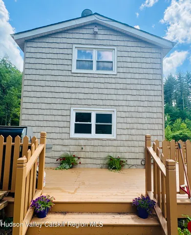 a view of front door and potted plants
