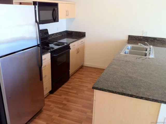 a kitchen with a stove and a microwave