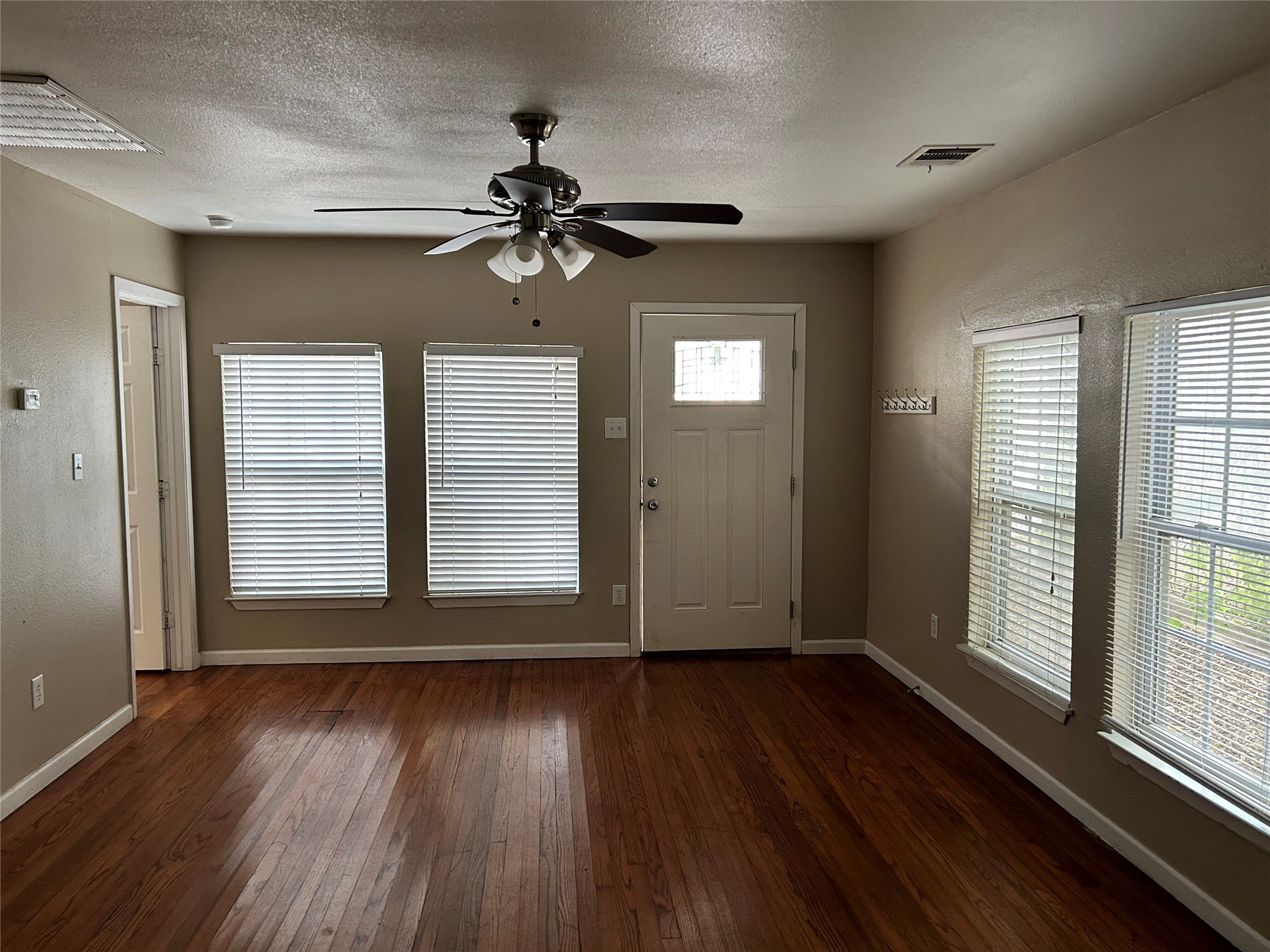 3105 Kings Lane Austin, TX 78705 - Photo 11 of 12 wooden floor in an empty room with a window