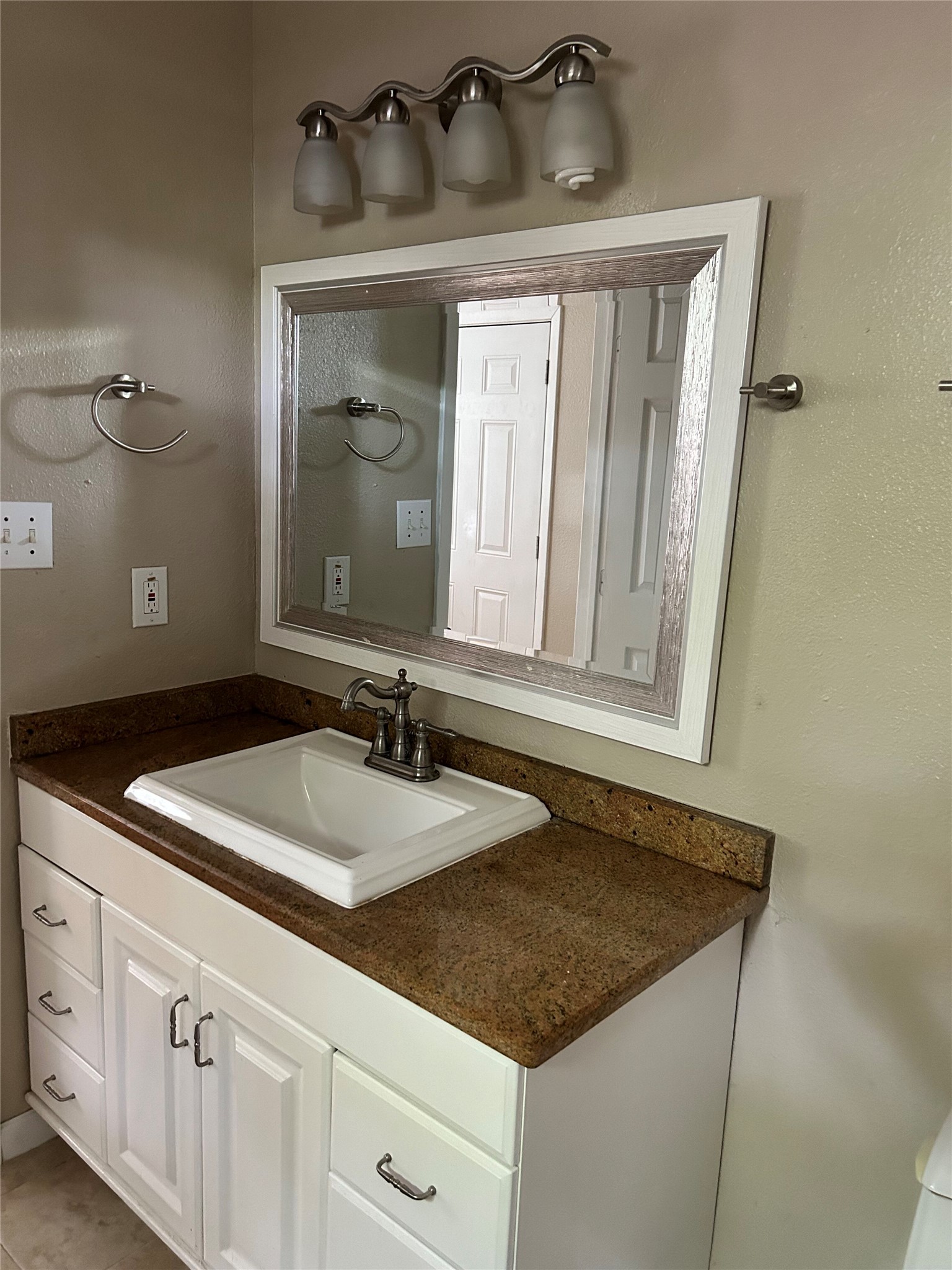 3105 Kings Lane Austin, TX 78705 - Photo 8 of 12 a bathroom with a granite countertop sink and a mirror
