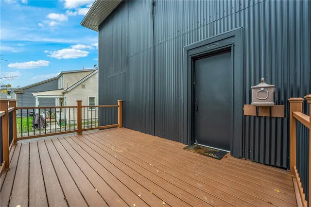 a view of backyard with a wooden deck