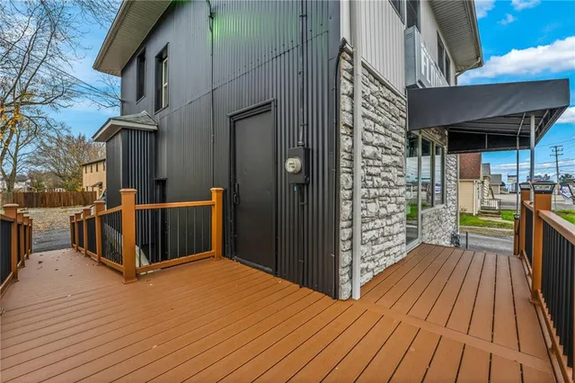 a view of a balcony with wooden floor
