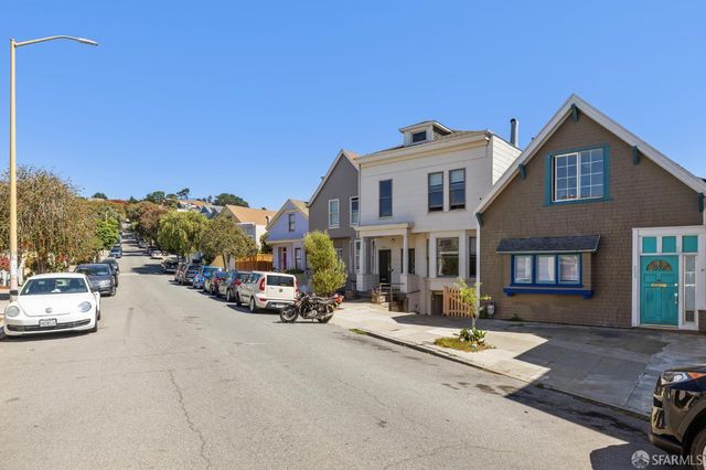 a view of a parked cars in front of a building