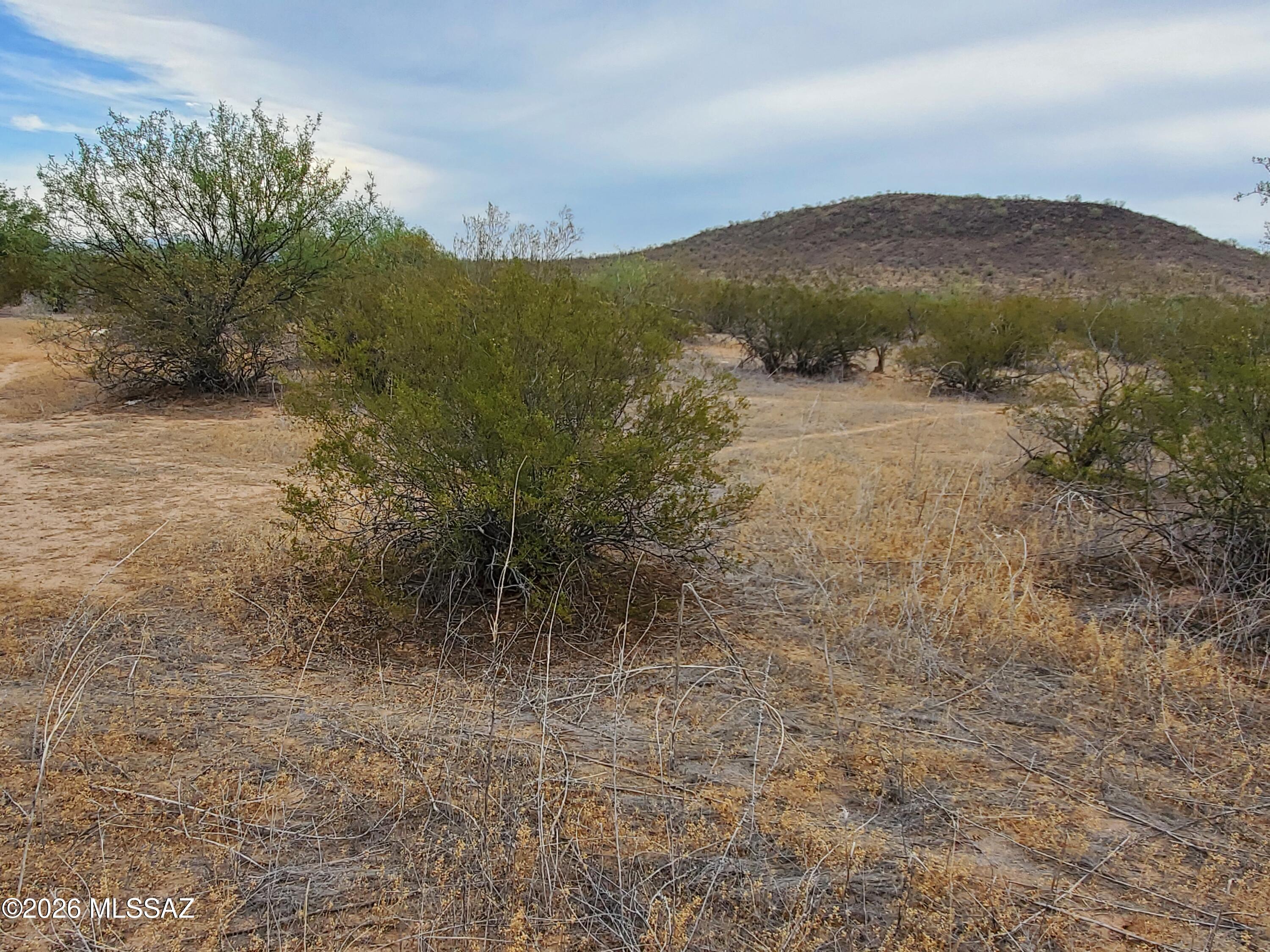 7925 South Worden Road Tucson, AZ 85735 - Photo 14 of 20 a view of a lake with mountains in the background