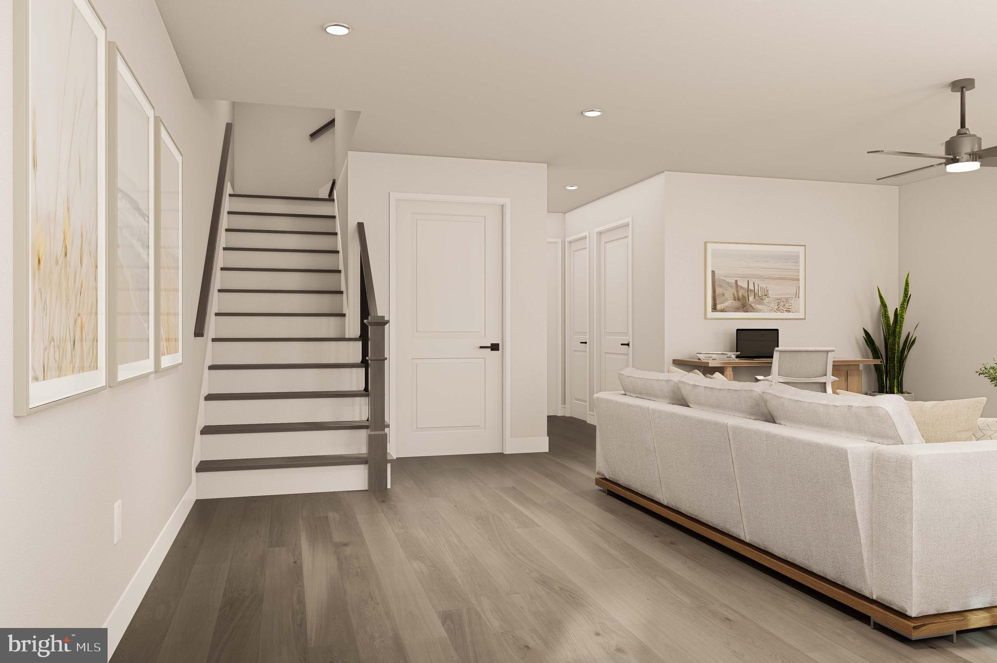 403 Pennybrook Court, Unit 2 Flourtown, PA 19031 - Photo 3 of 19 a view of a livingroom with furniture and stairs
