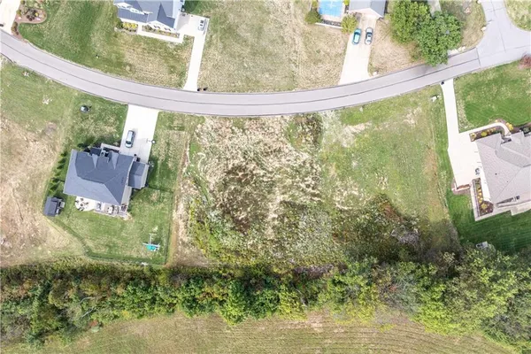 a view of a back yard from a balcony