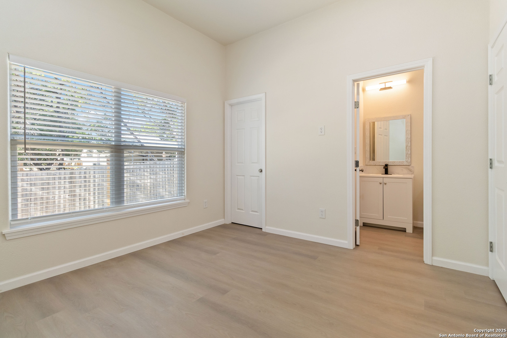 324 Ridgerock Drive, Unit 1 Canyon Lake, TX 78133 - Photo 15 of 21 an empty room with a window and a bathroom