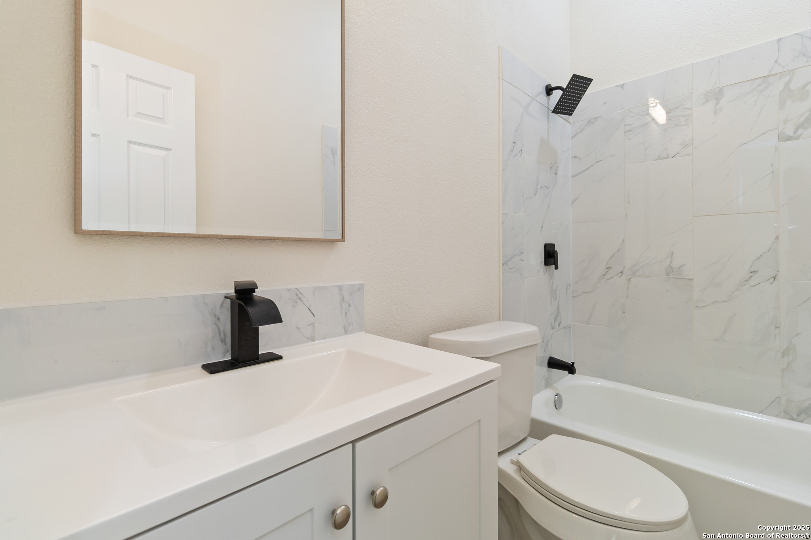 324 Ridgerock Drive, Unit 1 Canyon Lake, TX 78133 - Photo 17 of 21 a bathroom with a sink a toilet and a bathtub