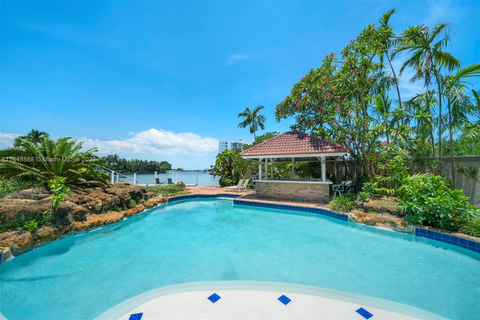 9224 Bay Drive Surfside, FL 33154 - Photo 11 of 11 a view of a swimming pool and lounge chair