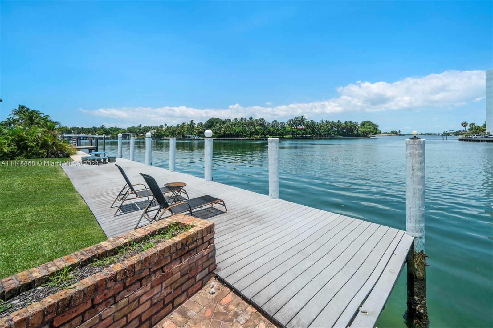 9224 Bay Drive Surfside, FL 33154 - Photo 4 of 11 a view of a wooden deck with lake view