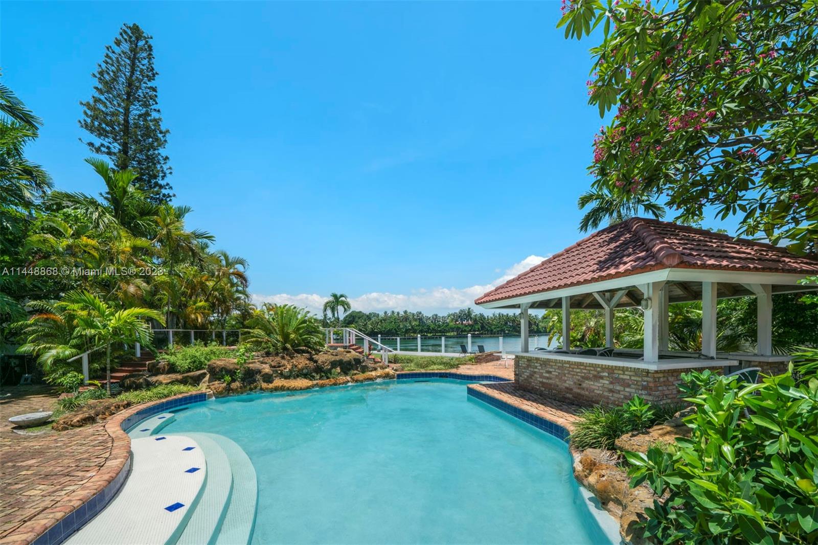 9224 Bay Drive Surfside, FL 33154 - Photo 5 of 11 a view of a house with a yard