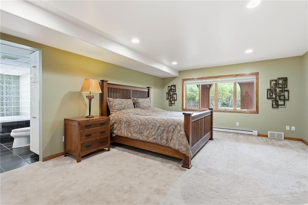 265 McFann Road Valencia, PA 16059 - Photo 37 of 50 a bedroom with a bed and large windows