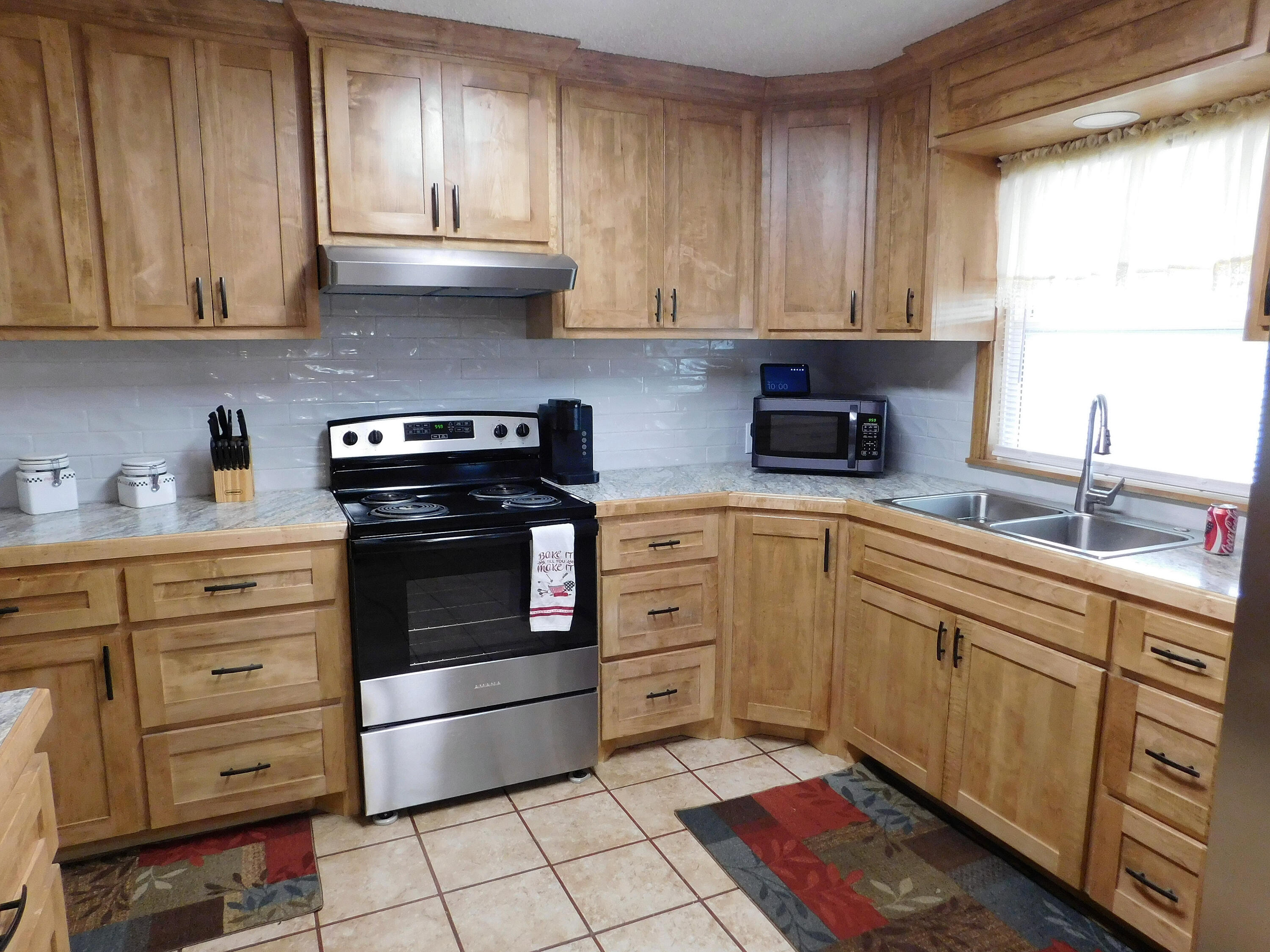 122 West 16th Street Muleshoe, TX 79347 - Photo 13 of 27 a kitchen with appliances cabinets and a sink