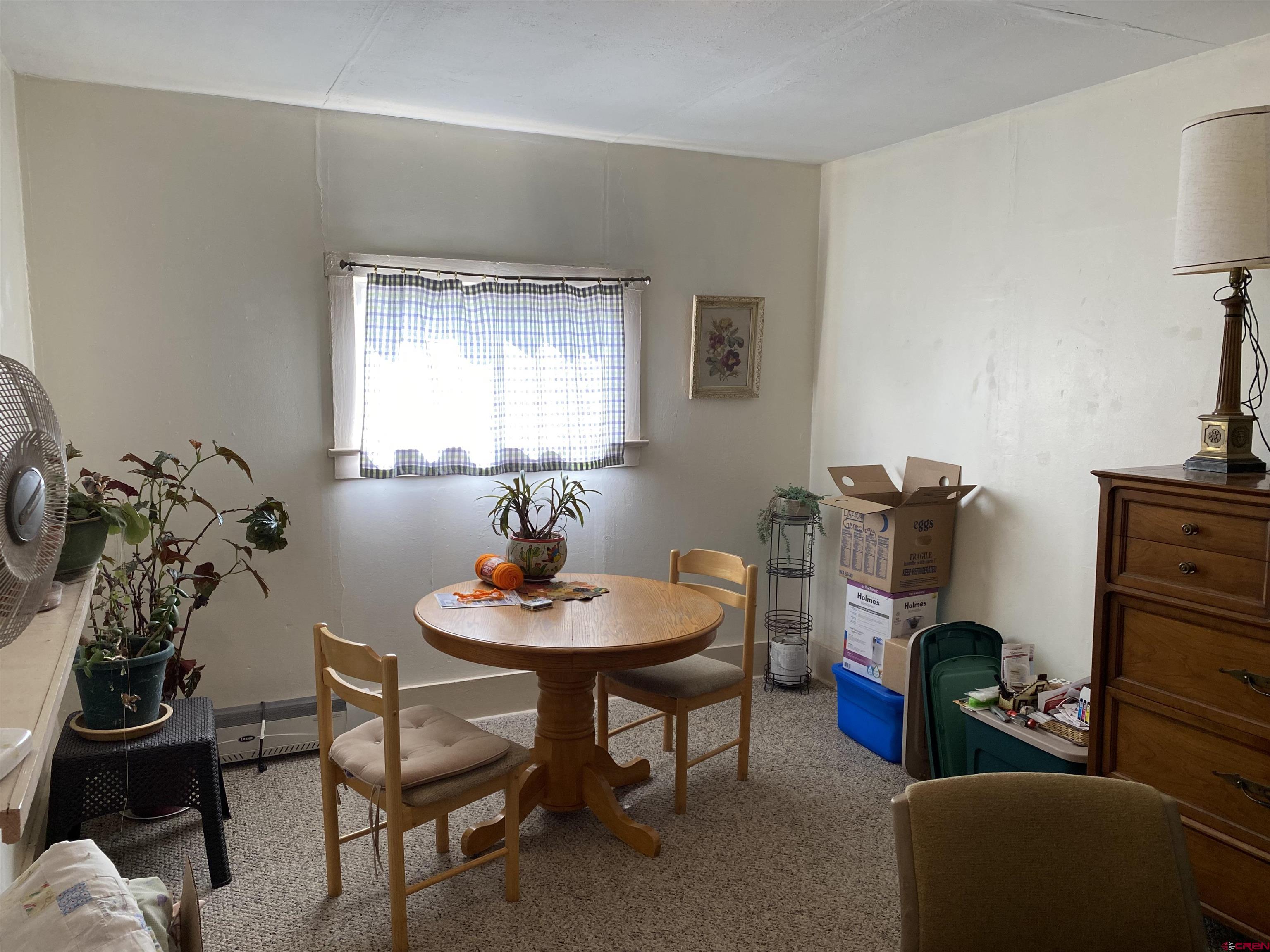 21236 Lanning Road Austin, CO 81410 - Photo 15 of 21 a dining room with furniture and a window