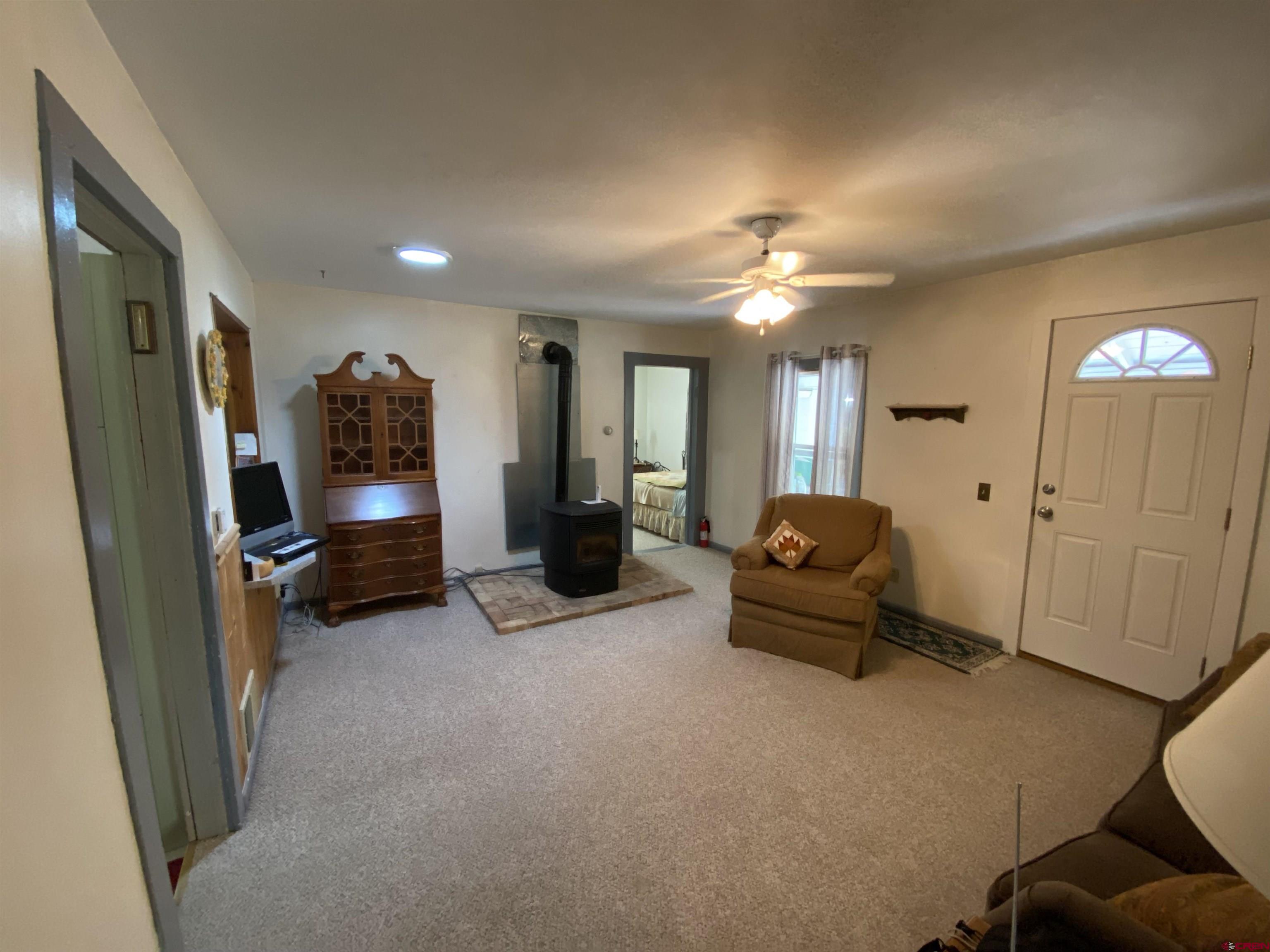 21236 Lanning Road Austin, CO 81410 - Photo 5 of 21 a living room with furniture and a chandelier