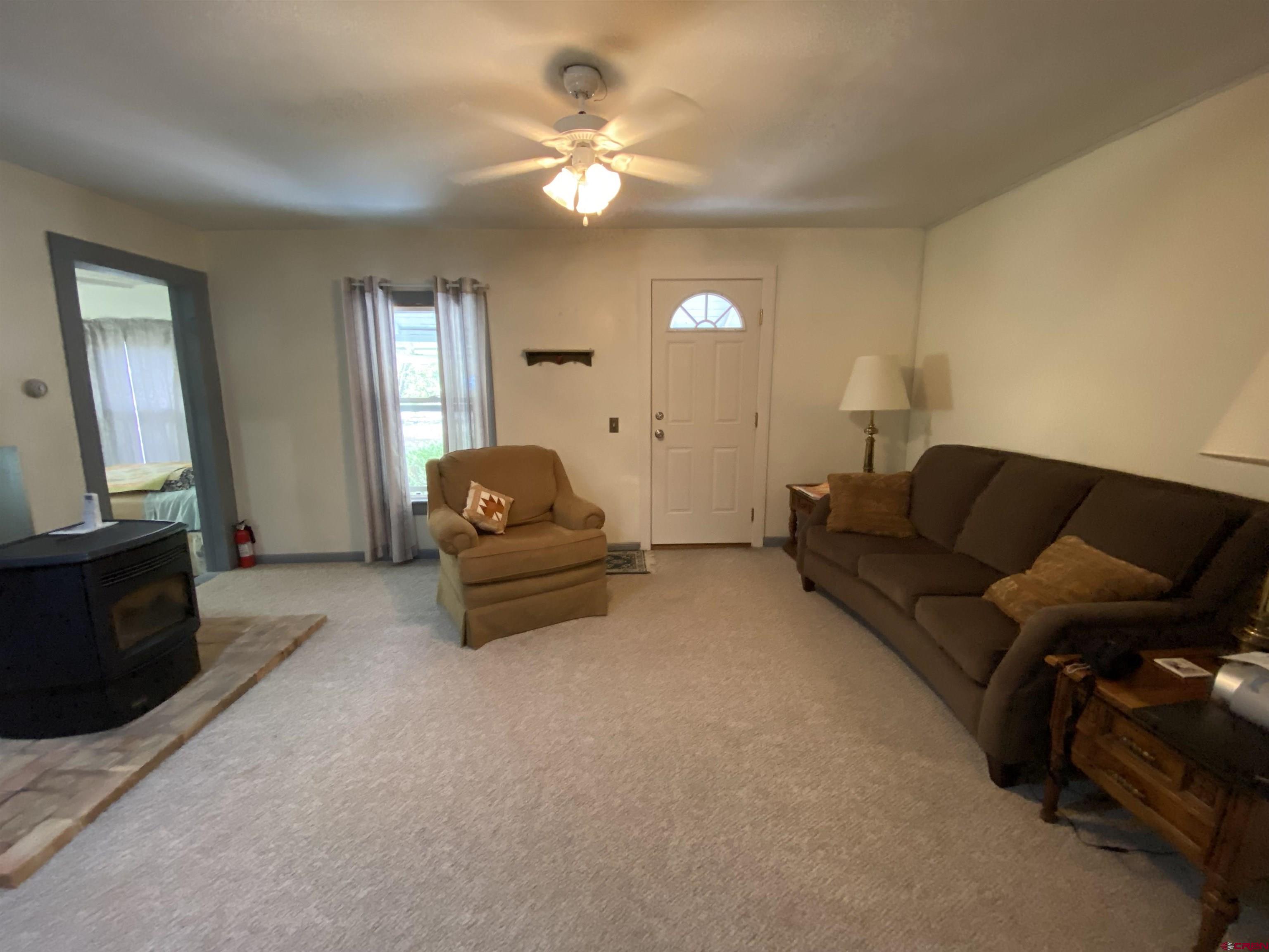 21236 Lanning Road Austin, CO 81410 - Photo 6 of 21 a living room with furniture and a flat screen tv