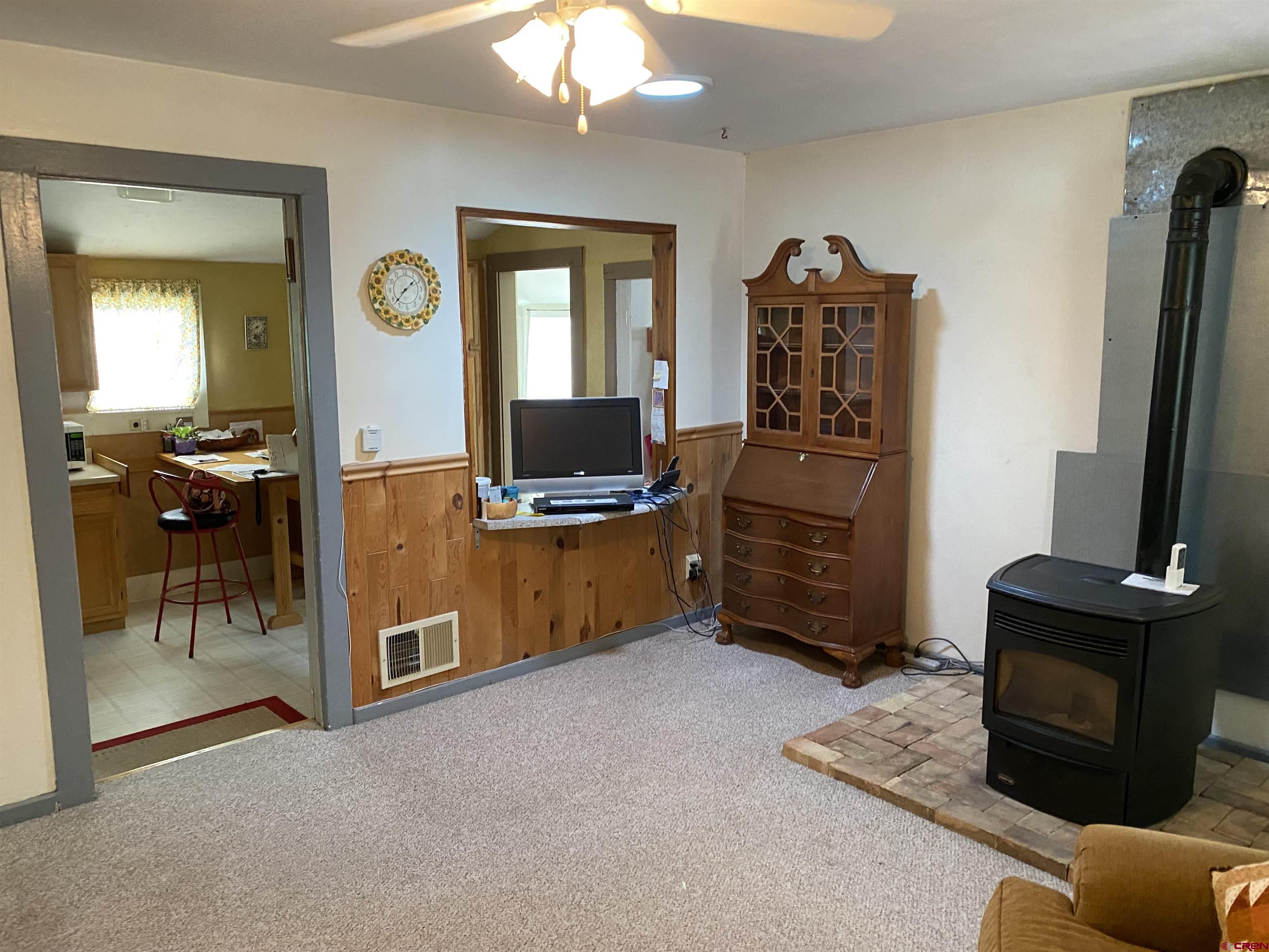 21236 Lanning Road Austin, CO 81410 - Photo 8 of 21 a view of a workspace with furniture and a flat screen tv