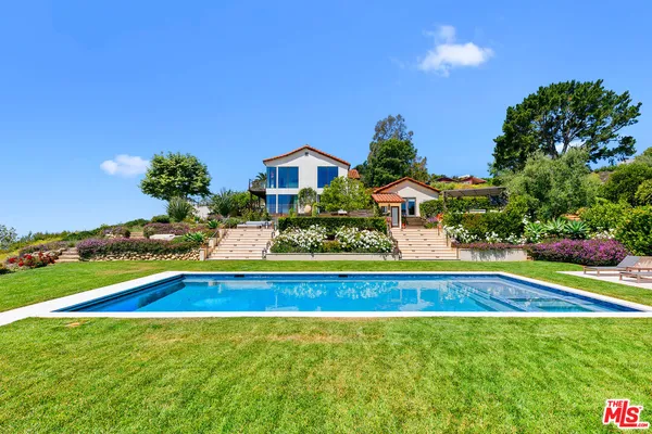 a bathroom with a double vanity sink toilet and shower