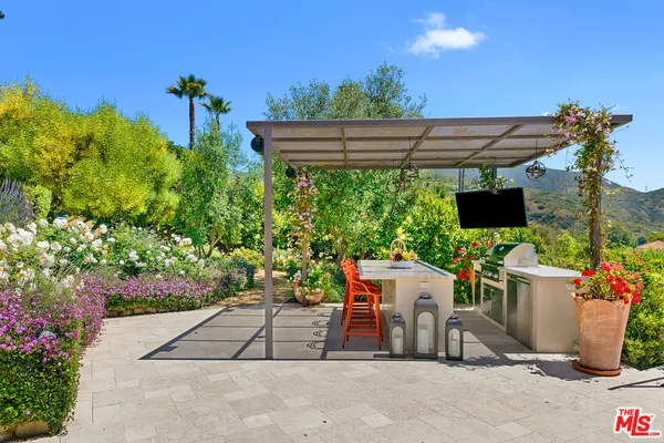 a bed room with a bed and a large window