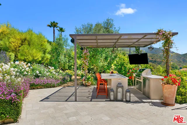 a bed room with a bed and a large window