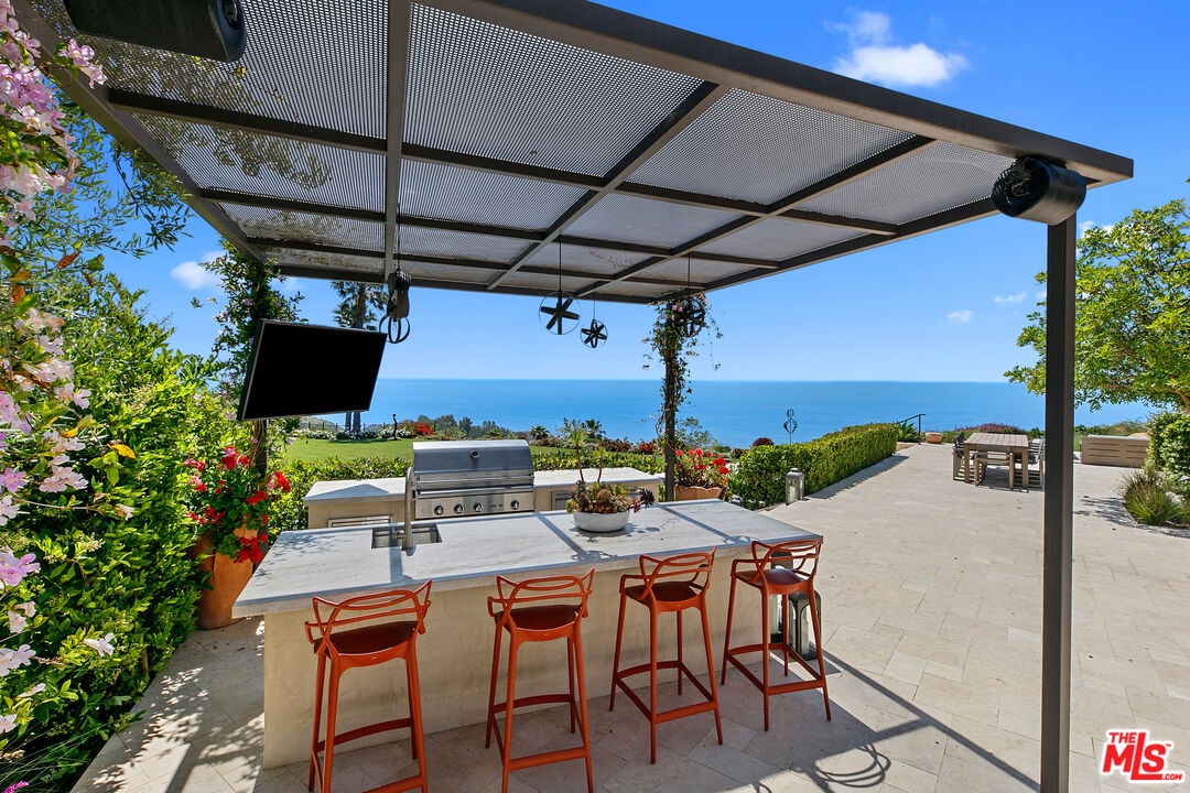 27450 Calicut Road Malibu, CA 90265 - Photo 34 of 59 a view of an outdoor space with a table and chairs