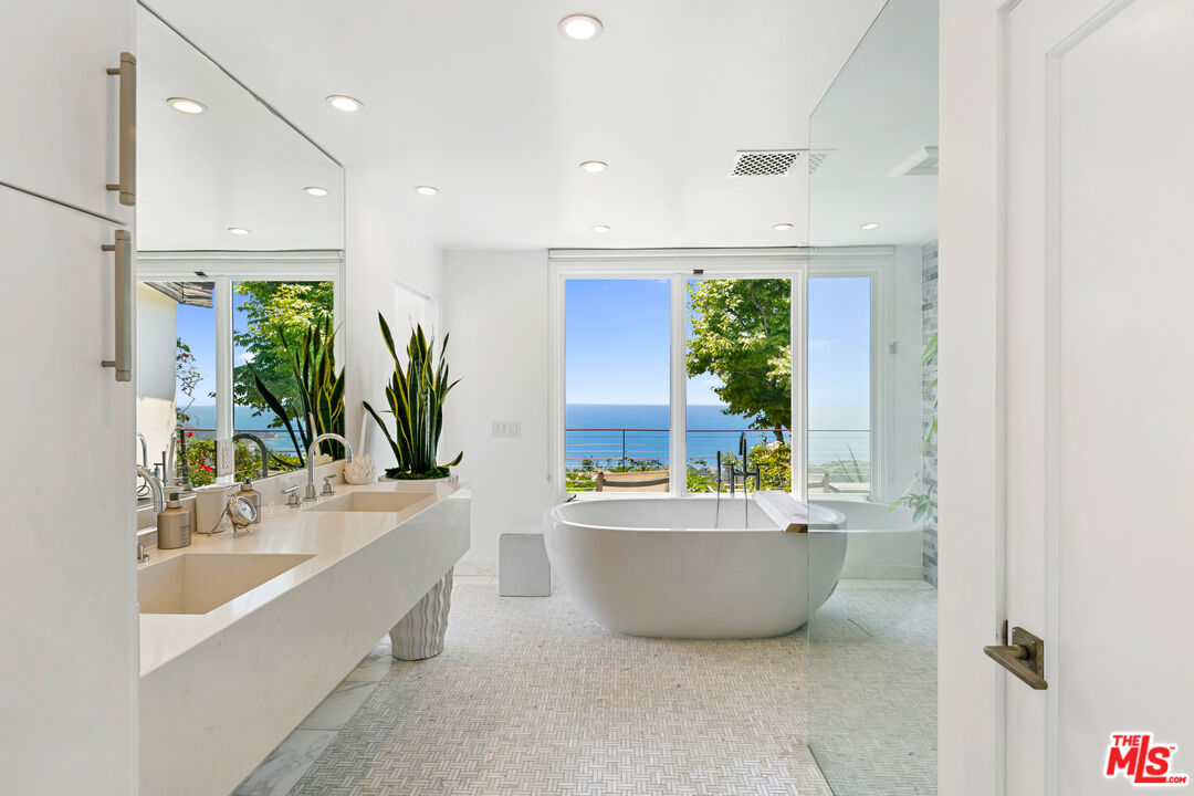 27450 Calicut Road Malibu, CA 90265 - Photo 39 of 59 a bathroom with a bathtub sink and mirror