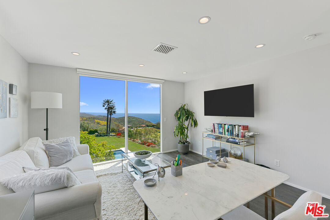 27450 Calicut Road Malibu, CA 90265 - Photo 43 of 59 a living room with furniture and a flat screen tv