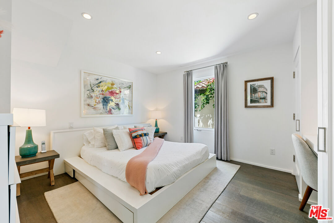 27450 Calicut Road Malibu, CA 90265 - Photo 51 of 59 a bedroom with a bed and a painting on the wall