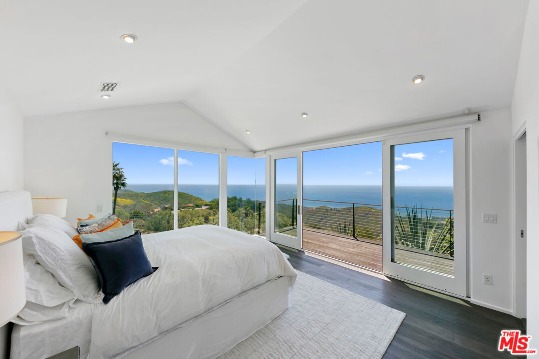27450 Calicut Road Malibu, CA 90265 - Photo 6 of 59 a bed room with a bed and a large window