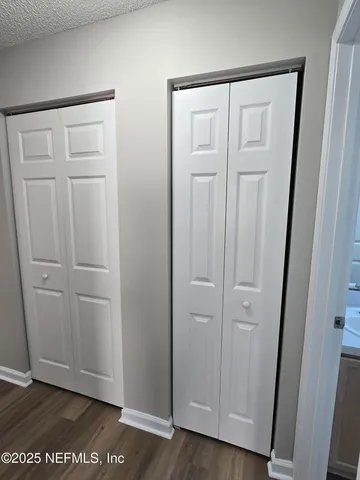 an empty room with wooden floor