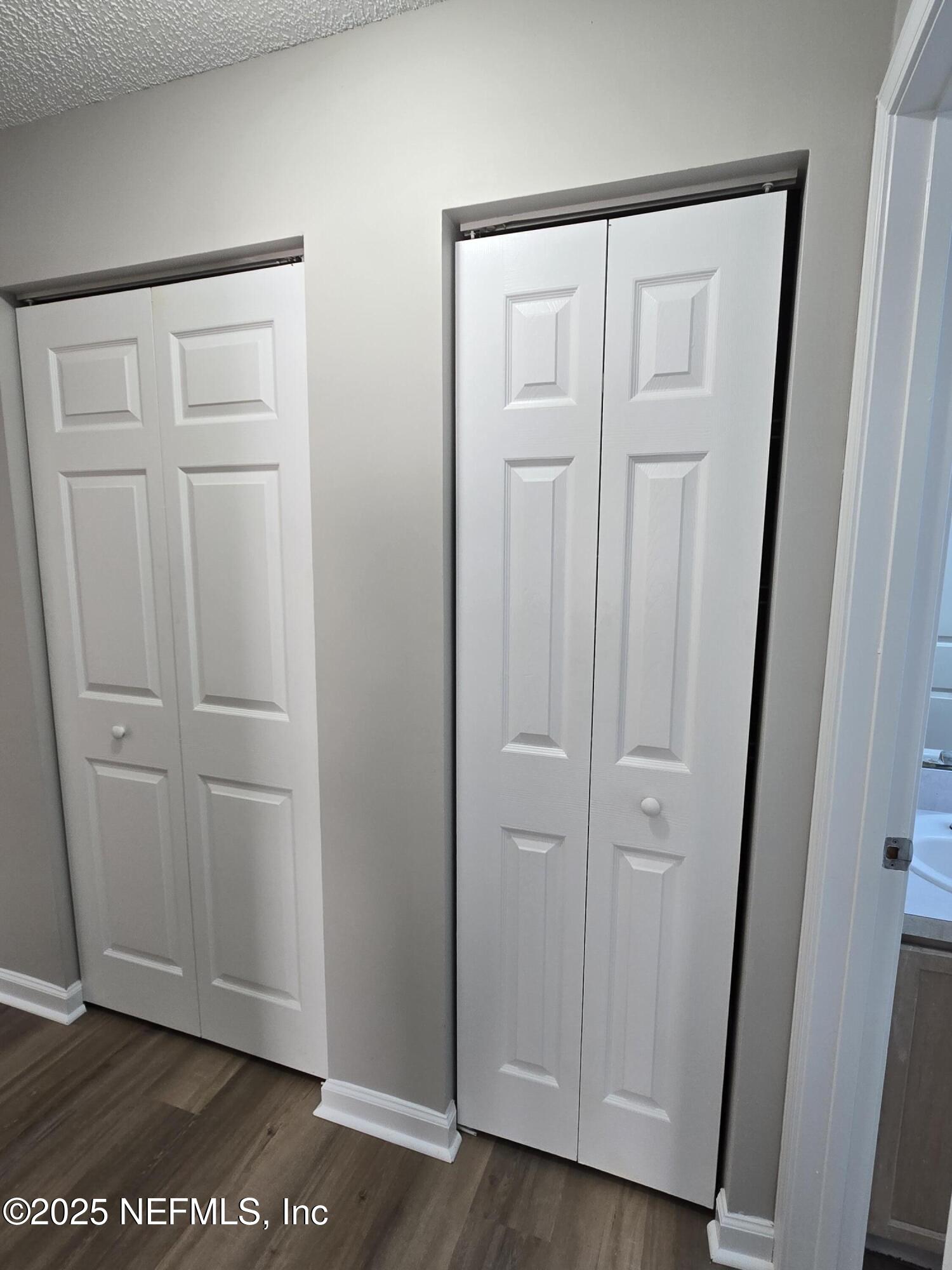 744 Palm Hammock Circle St. Augustine, FL 32095 - Photo 19 of 34 an empty room with wooden floor