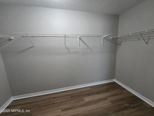 a view of a room with racks on the wall