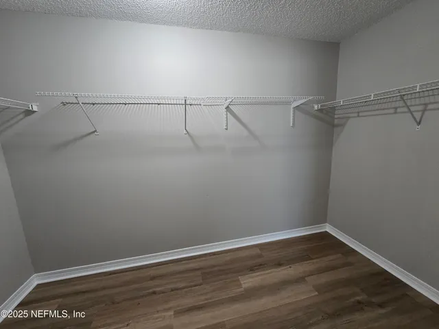 a view of a room with racks on the wall