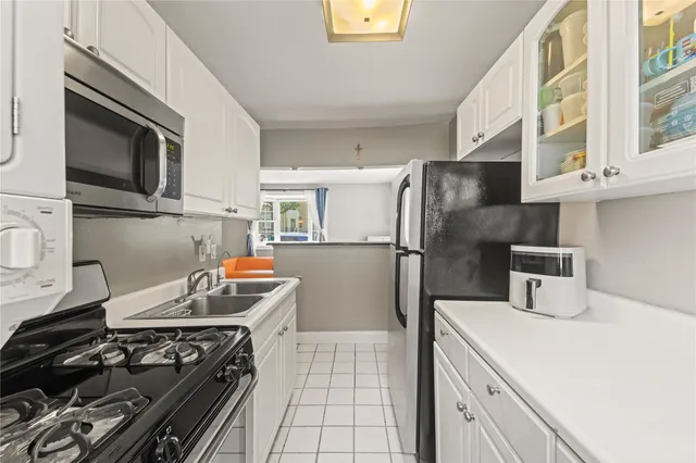 a kitchen with stainless steel appliances granite countertop a stove and a refrigerator