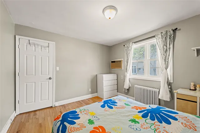 a bedroom with a bed and a table in it