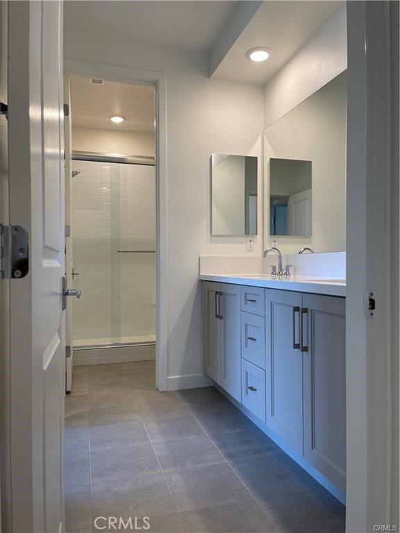 1632 Doheny Way Dana Point, CA 92629 - Photo 19 of 47 a bathroom with a double vanity sink toilet and shower