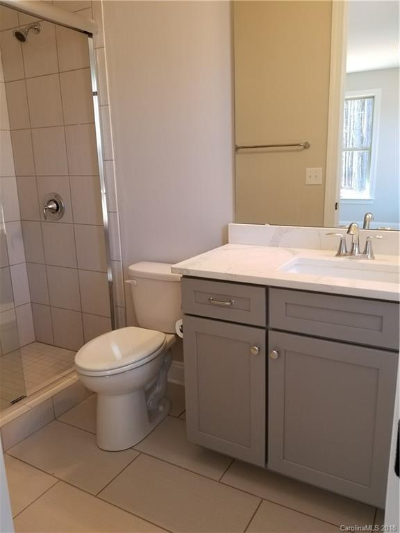 1094 Trinity Ridge Parkway, Unit 51 Fort Mill, SC 29715 - Photo 13 of 17 a bathroom with a toilet sink and mirror