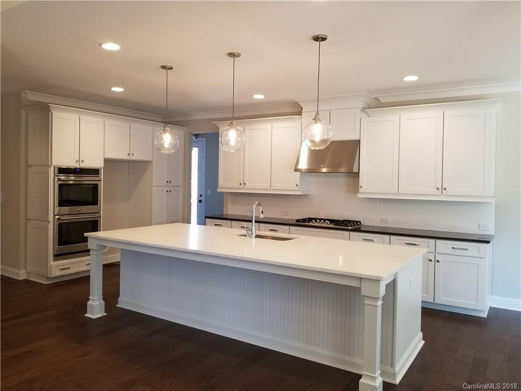 1094 Trinity Ridge Parkway, Unit 51 Fort Mill, SC 29715 - Photo 17 of 17 a large kitchen with stainless steel appliances granite countertop a sink a stove and a granite counter tops
