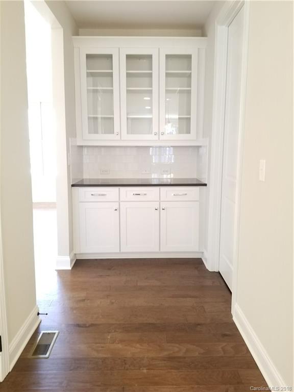 1094 Trinity Ridge Parkway, Unit 51 Fort Mill, SC 29715 - Photo 6 of 17 a view of an empty room with wooden floor and a window