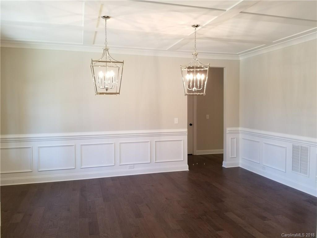 1094 Trinity Ridge Parkway, Unit 51 Fort Mill, SC 29715 - Photo 7 of 17 a view of an empty room with wooden floor and window