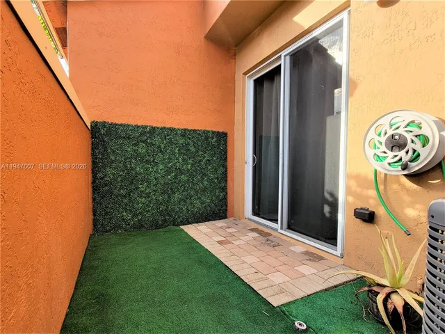 a view of a backyard with garden