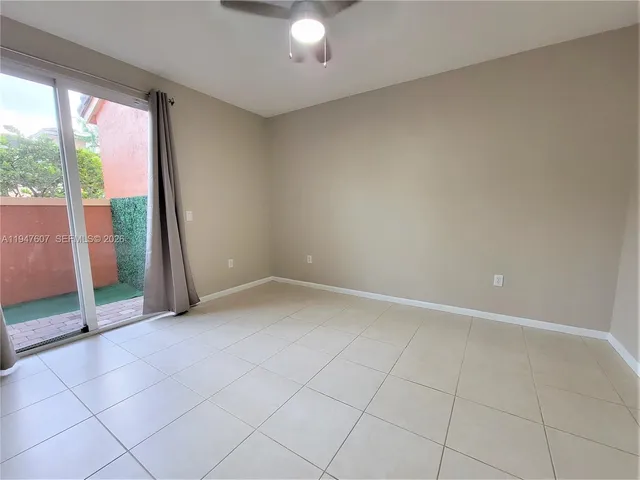 an empty room with sliding glass door